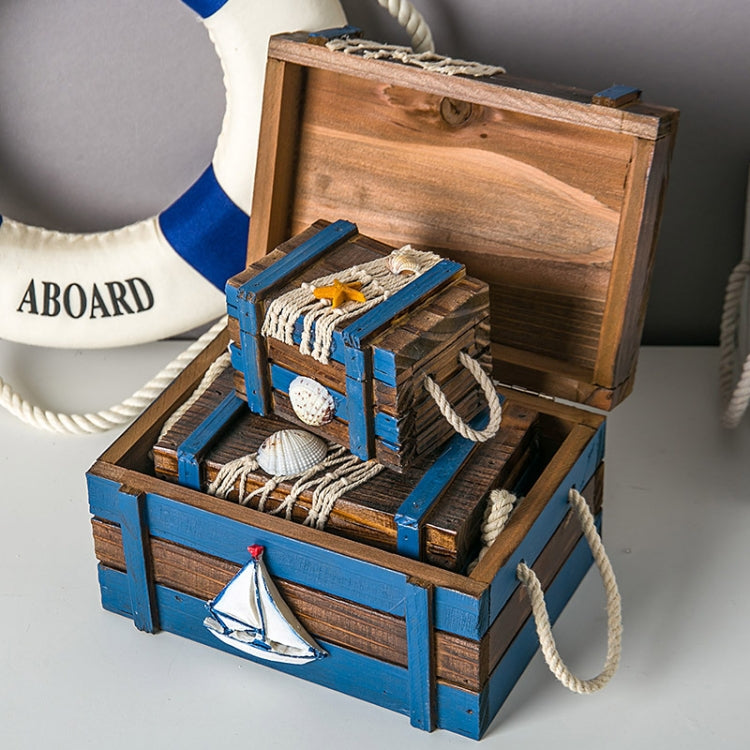Antique blue wooden jewelry storage box with open lid, small rope handles, nautical decor