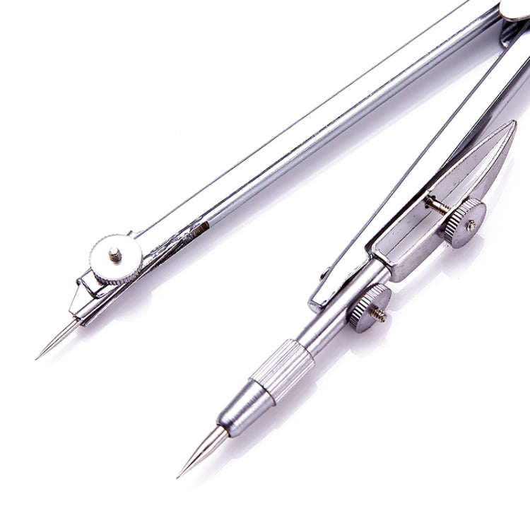 Chrome drawing compass close-up with adjustable central joint and lead point