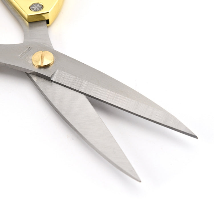 Close-up of silver diamond scissors blades with textured grip and rivet detail