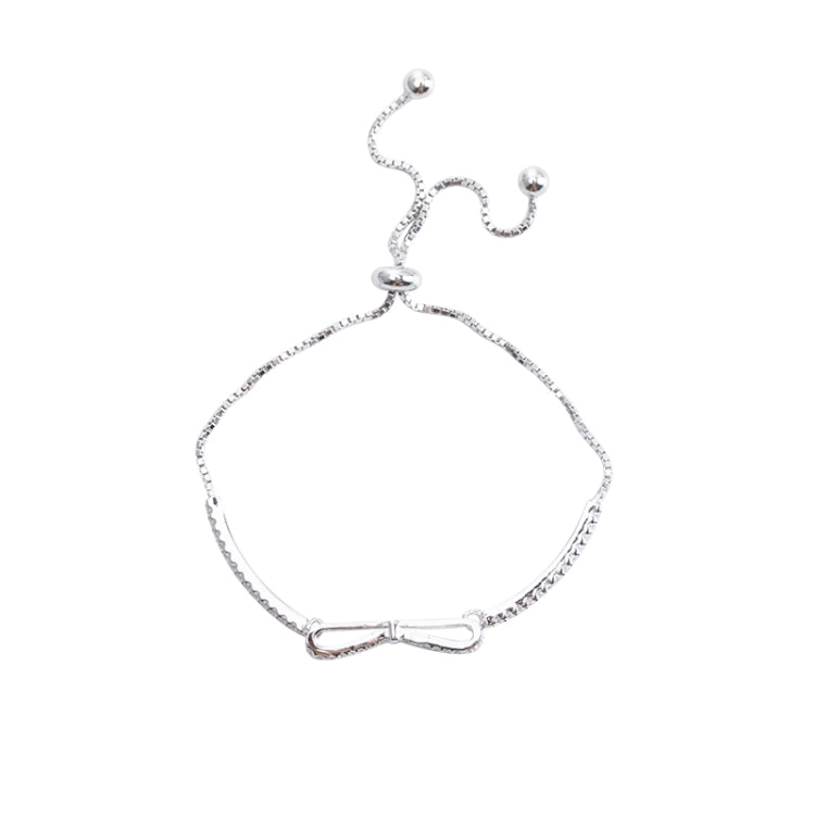 Silver bowknot stretch bracelet with dangling bead accents for girls