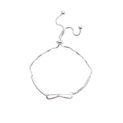 Silver bowknot stretch bracelet with dangling bead accents for girls