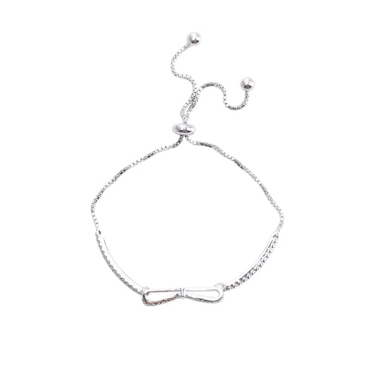 Silver bowknot stretch bracelet with dangling bead accents for girls