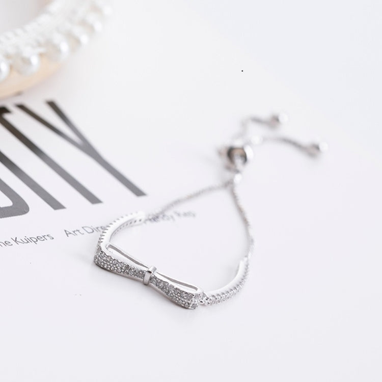 Silver stretch bracelet with bow centerpiece and sparkle band