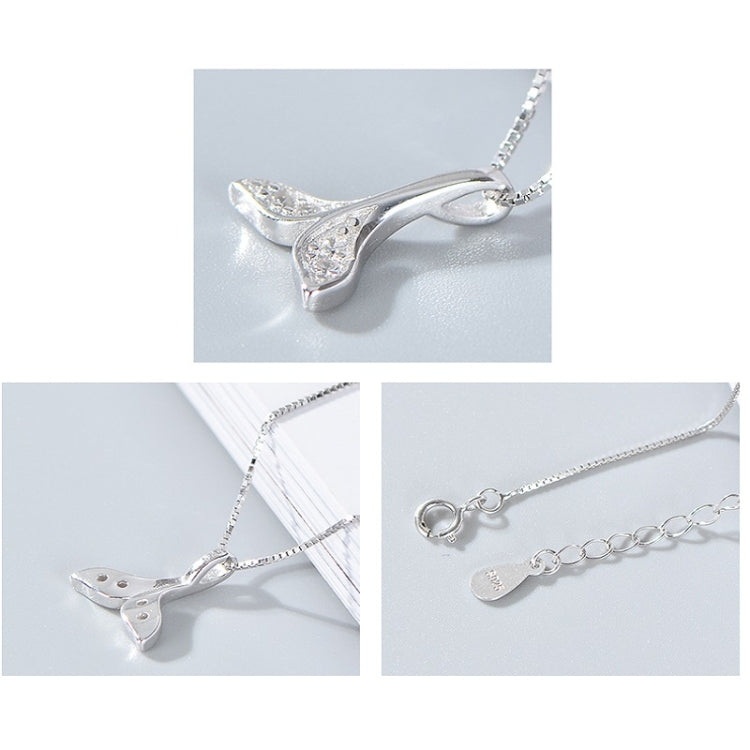 Silver whale-tail pendant necklace shown in multiple close-up angles