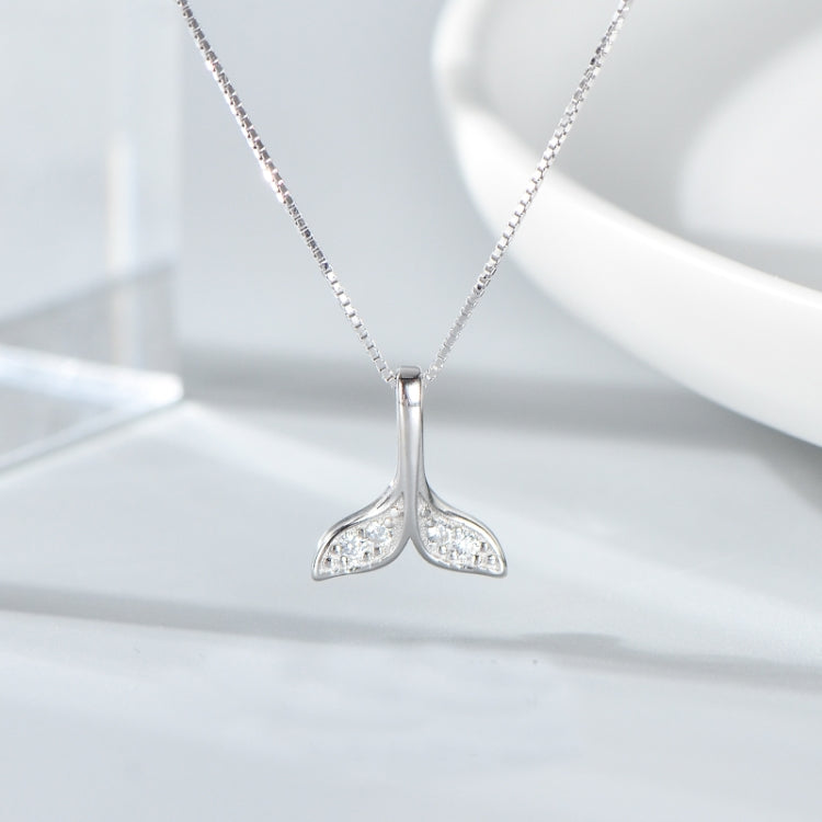 Silver whale-tail necklace with rhinestone pendant centered on chain