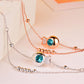 Rose gold girls anklet with blue zircon round charms and bead accents