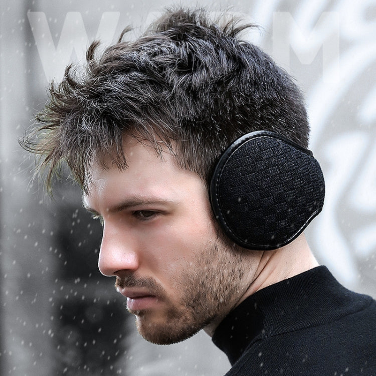 Men's black plush foldable earmuffs over ears, side view for winter warmth