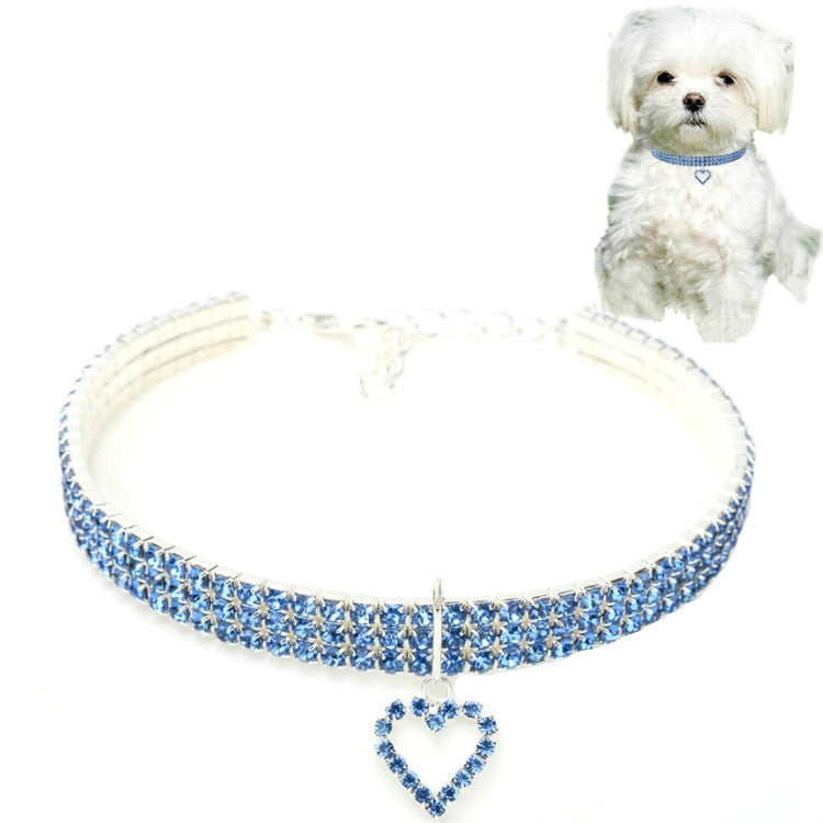 Blue jeweled elastic pet collar with heart charm pendant and buckle clasp