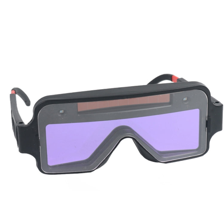 Black welding safety goggles with purple tinted auto-dimming lens
