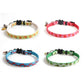 Four fruit pattern cat collars with black buckles and bell charms in green, red, blue, and white