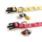 Fruit cat collar close-up with pineapple and watermelon bell charms on matching straps