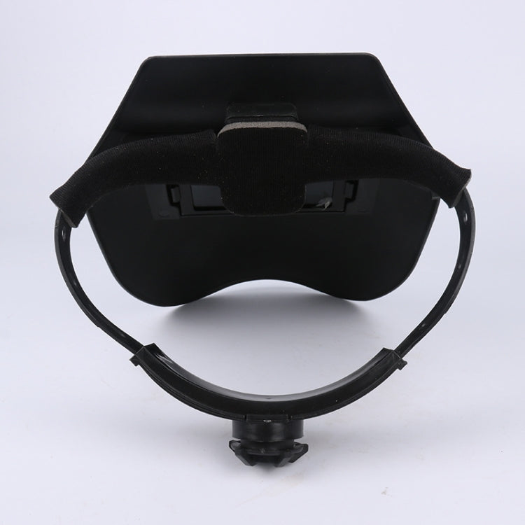 Welding helmet with circular brow strap and centered headband mount, dark gray