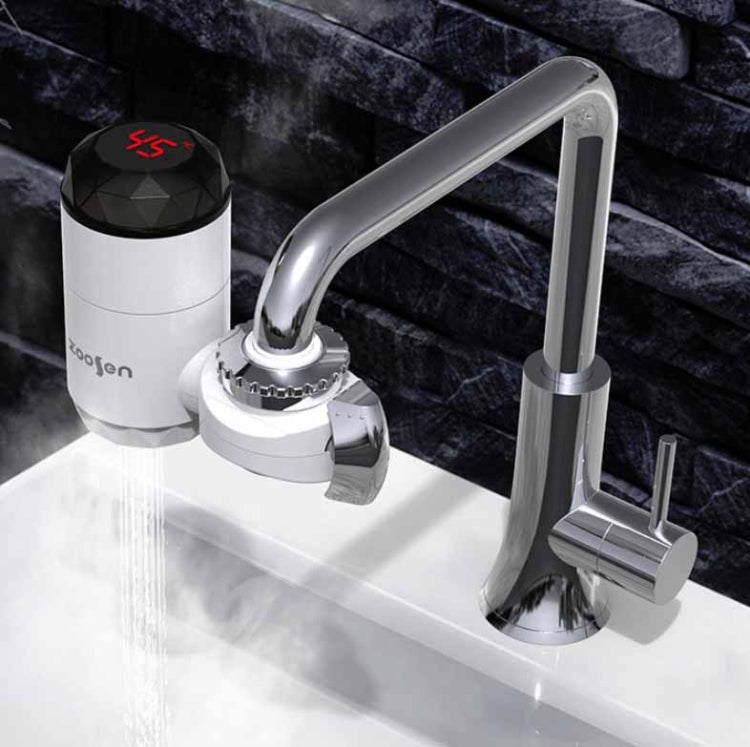 White electric instant hot water faucet installed over sink with steady water stream