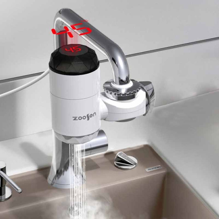 White electric instant hot water faucet with flowing stream from chrome spout