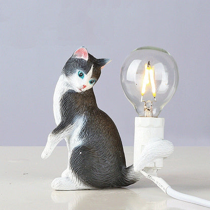 Cat mini night light: black-and-white cat figure holding a glowing light bulb
