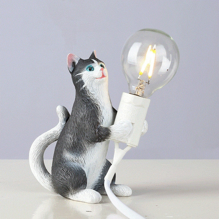 Cat mini night light: black-and-white cat figure upright beside a glowing light bulb