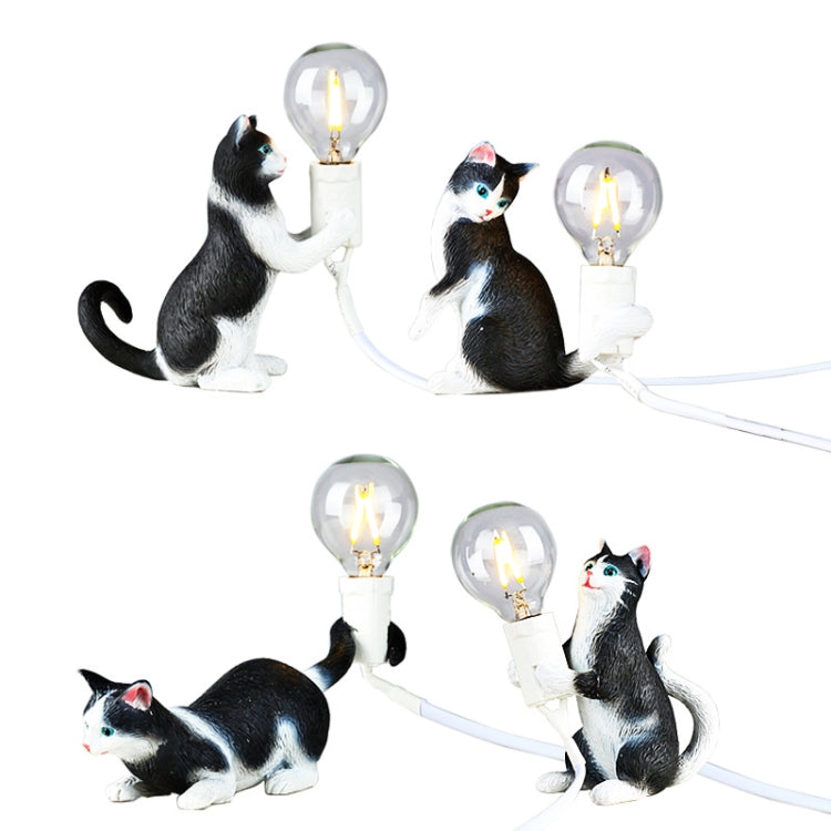 Set of cat figurine mini night light table lamps with glowing bulbs, dark gray and white cats
