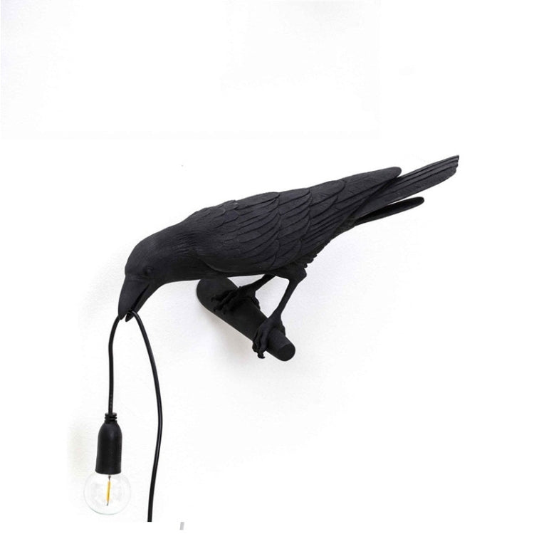 Black bird wall lamp figurine with hanging bulb and exposed wire cord
