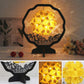 Paper carving shadow lamp on black stand, yellow floral paper shade with lace pattern