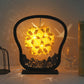 Paper carving shadow lamp with arched black frame, yellow starburst paper glow