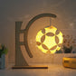 Paper carving shadow lamp with arc stand, yellow geometric paper shade glowing