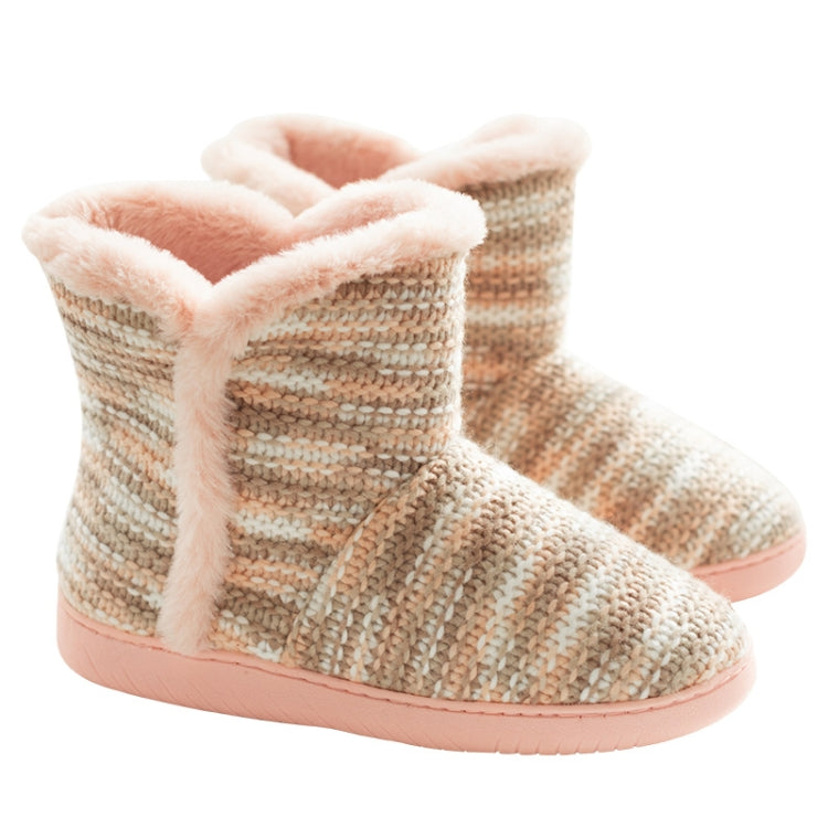 Pair of beige knit indoor slippers with pink fuzzy cuff and thick pink sole.