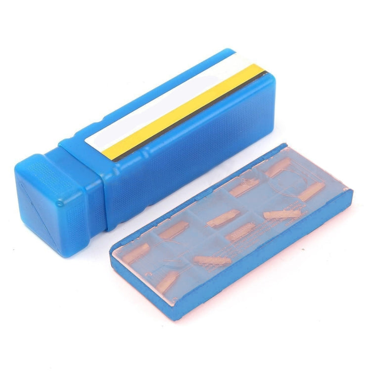 Lathe tool holder and gold inserts in blue plastic storage case