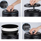 Hands installing a round foam filter into a black air purifier top housing