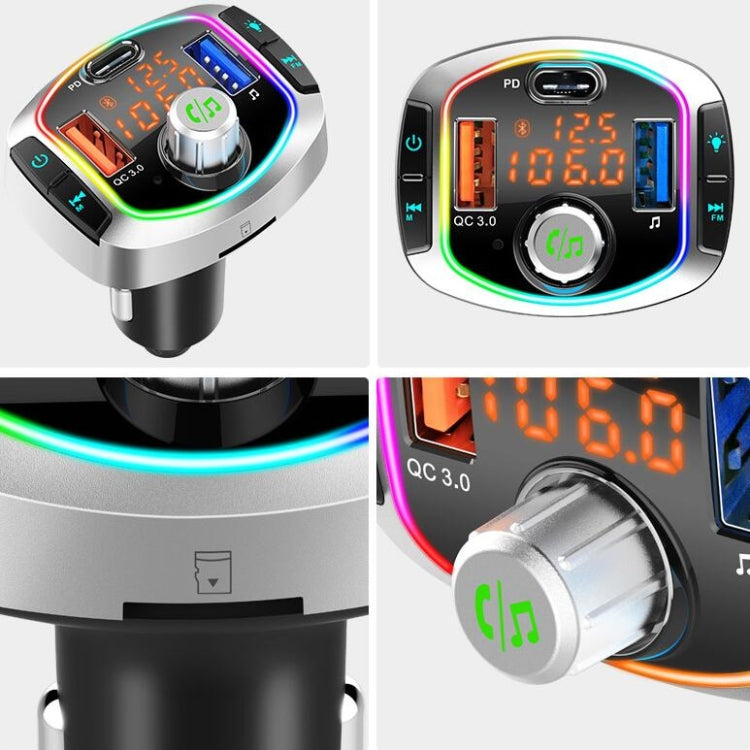 Car audio adapter close-up with digital screen, rotary knob, and RGB-lit charging ports.