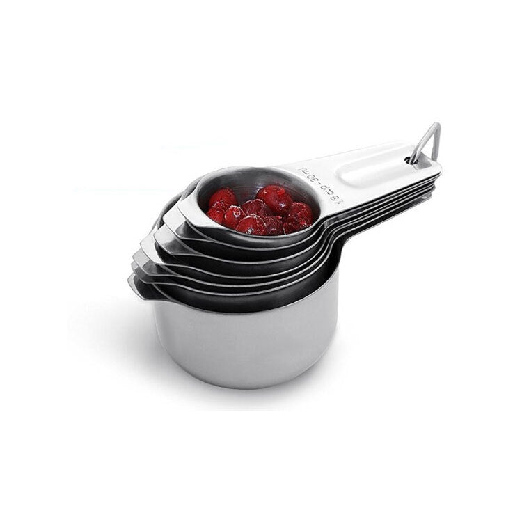 Stainless steel measuring cup stack with red ingredients in one cup, loop handle