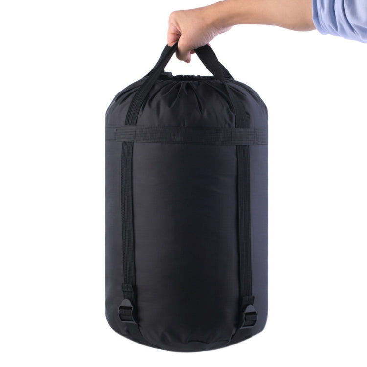 Black sleeping bag storage bag with carry handle and adjustable front compression straps