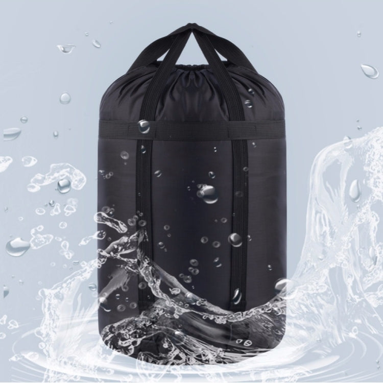 Black waterproof sleeping bag storage bag with drawstring top, shown with water droplets