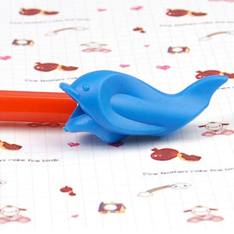 Blue dolphin-shaped posture pen lying on printed stationery paper