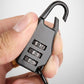 Black helmet cable lock with four-digit combination keypad held in a hand