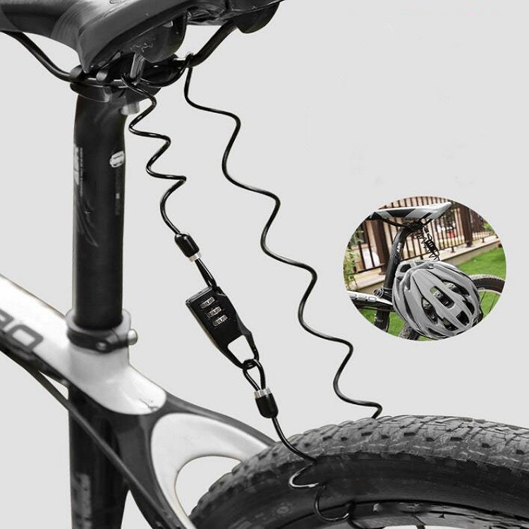 Black coiled cable helmet lock mounted on a bike frame with combination keypad
