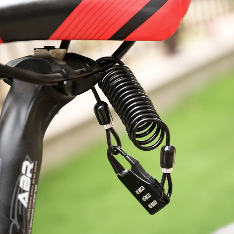 Black combination cable lock attached to a bike handle area with coiled spring cord