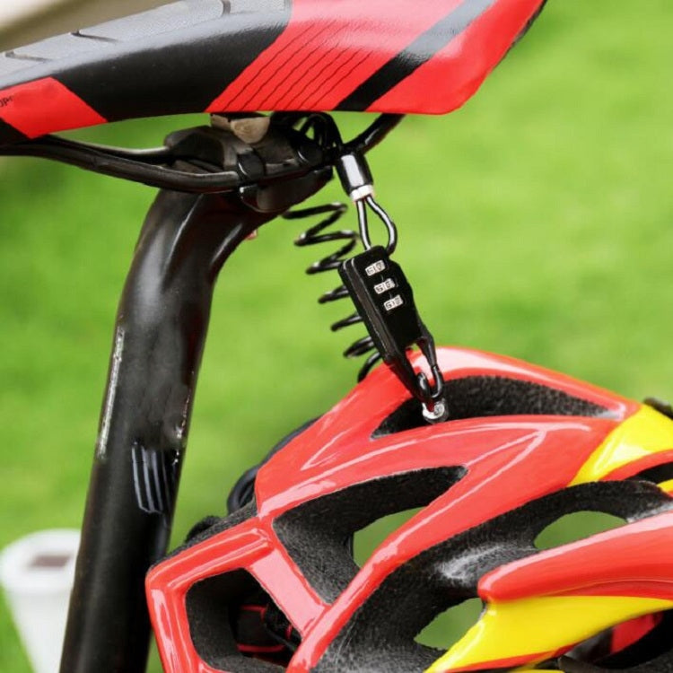 Combination cable lock attached to a red bicycle near the helmet mount with coiled cord