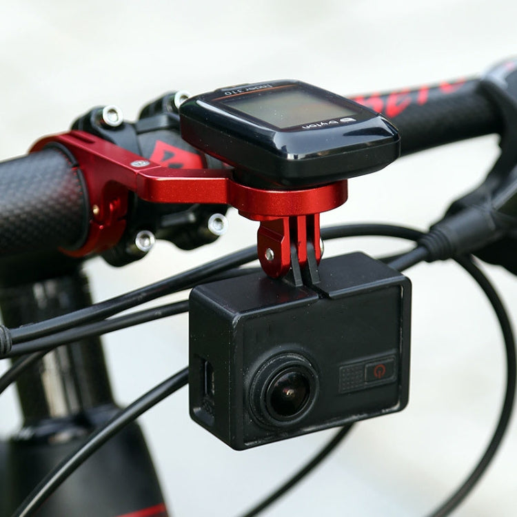 Red bike handlebar extension mount holding a black camera in front of the bars