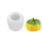 Silicone candle mold with pumpkin cavity and yellow-green pumpkin
