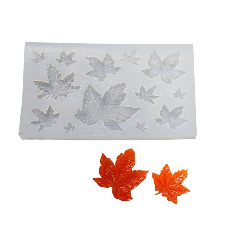 Leaf silicone candle mold tray with raised autumn leaf shapes and orange leaves