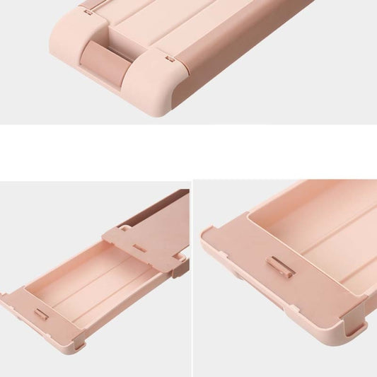 Pink under-desk storage box close-up with hinged tray cover and side handle.