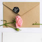 Round thank you seal sticker on kraft envelope, black design with red heart