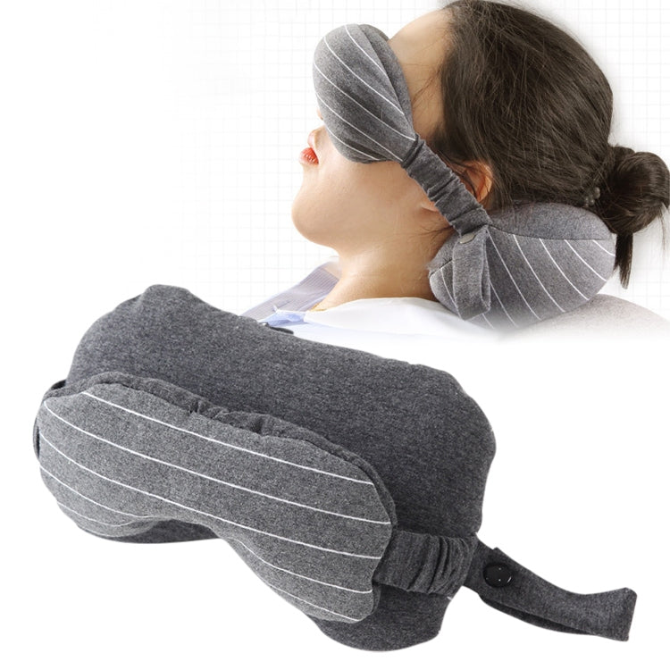 Dark gray travel neck pillow with attached striped eye mask for sleeping support