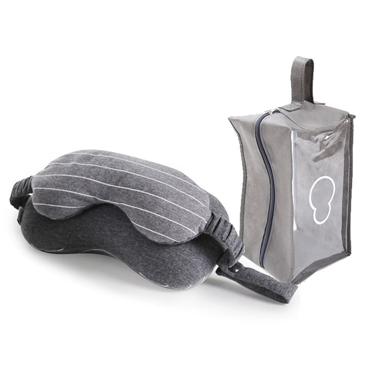 Dark gray striped neck pillow with attached eye mask, folded with carry case