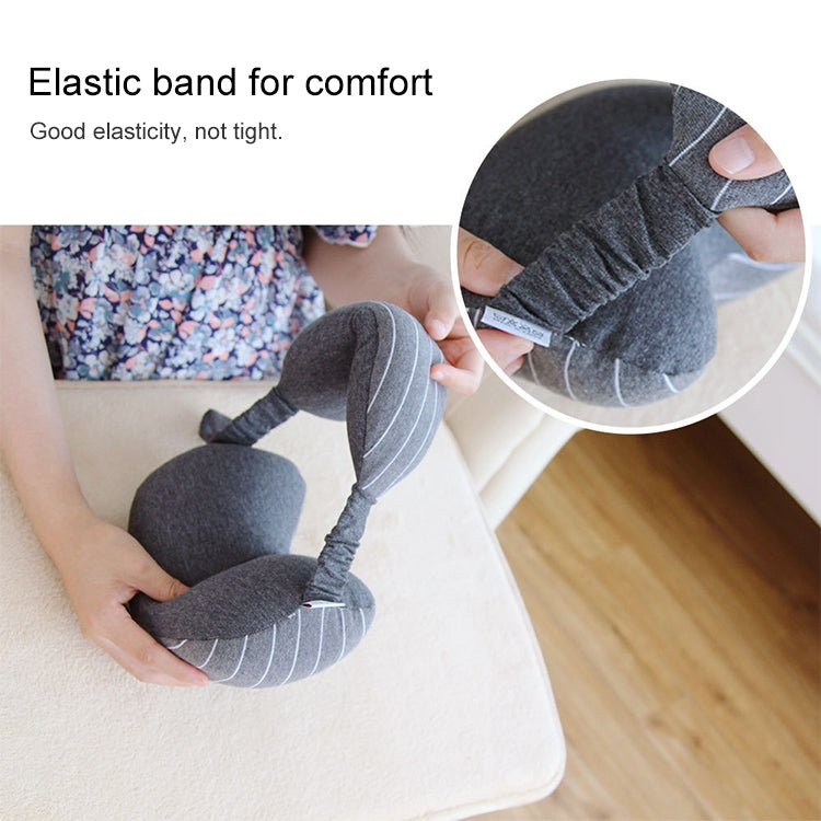 Dark gray neck pillow with elastic band and attached striped eye mask for comfort