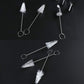Assorted nozzle cleaning brushes with white nylon bristles on silver wire and ring ends