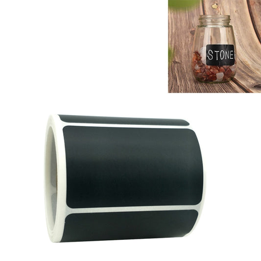 Chalkboard sticker label roll with dark gray rectangular labels on a white backing strip