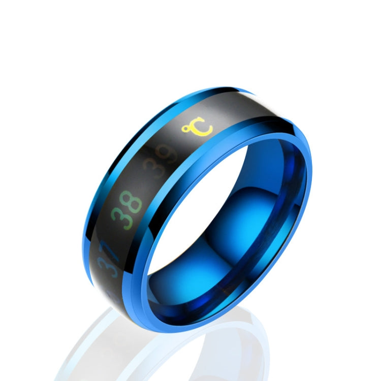 Smart temperature display ring with blue outer band and glowing yellow temperature icon