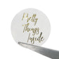 Round bronzing sealing sticker with gold “Pretty Things” script on light background
