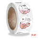Round cat thank-you cup stickers on roll, close-up, K-47 label